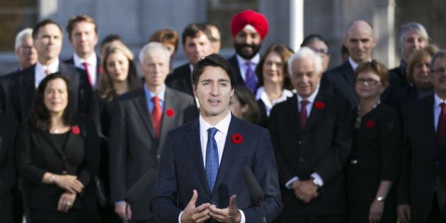 OTTAWA, Nov. 4, 2015-- Newly elected Canadian Prime Minister Justin Trudeau, front, delivers a statement after his swearing in ceremony at Rideau Hall in Ottawa, Canada, Nov. 4, 2015. Justin Trudeau was sworn in as Canada's 23rd prime minister and named a 31-member cabinet here Wednesday. (Xinhua/Chris Roussakis via Getty Images)