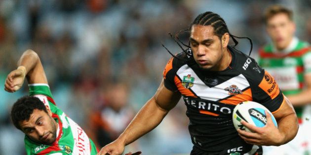 SYDNEY, AUSTRALIA - JUNE 12: Martin Taupau of the Tigers heads for the tryline dring the round 14 NRL match between the Wests Tigers and the South Sydney Rabbitohs at ANZ Stadium on June 12, 2015 in Sydney, Australia. (Photo by Cameron Spencer/Getty Images)