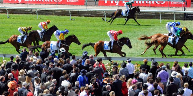 Large crowds watch Race 1 during Melbourne Cup Day at Flemington Racecourse, in Melbourne, Australia, Tuesday, Nov. 3, 2009. ( AP Photo/Andrew Brownbill)