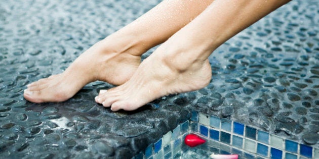 Woman's legs at the poolside