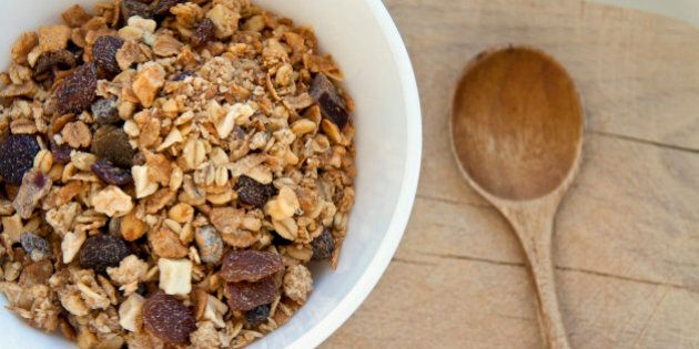 Bowl of organic muesli with nuts and spoon