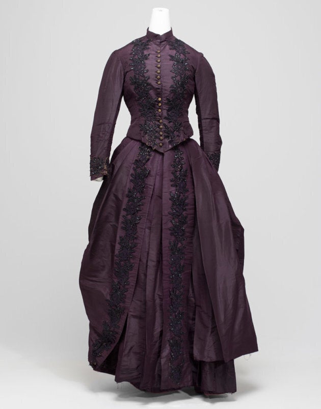 The provenance of this purple dress is unknown, but is an example of how women wore their best dress for the marriage thereby saving on cost.