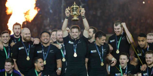 New Zealand's captain Richie McCaw holds the trophy aloft after the Rugby World Cup final between New Zealand and Australia at Twickenham Stadium in London, Saturday, Oct. 31, 2015. The All Blacks won 34-17. (AP Photo/Christophe Ena)