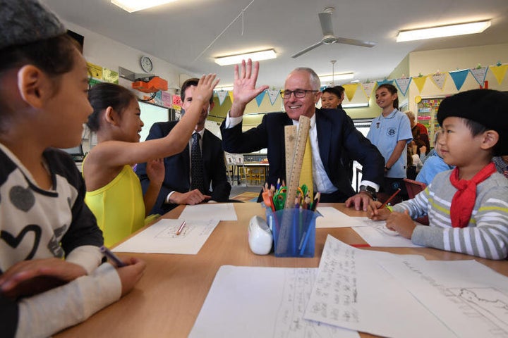 Prime Minister Malcolm Turnbull risks high-fiving kids at North Strathfield Public School.