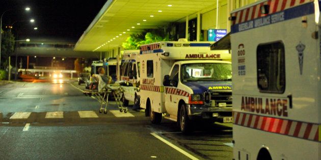 Ambulances are lined up outside the International Terminal as hospitals are being evacuated to Brisbane ahead of Cyclone Yasi at Cairns Airport on February 2, 2011. The severe catagory 4 storm is expected to reach landfall between Cairns and Townsville on February 2. AFP PHOTO / Paul CROCK (Photo credit should read PAUL CROCK/AFP/Getty Images)