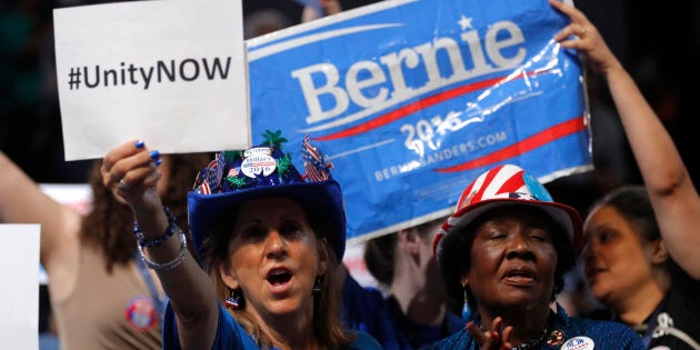 A protester, and supporter of Senator Bernie Sanders march in opposition to Hillary Clinton ahead of the Democratic National Convention in Philadelphia, Pennsylvania, U.S., July 24, 2016. REUTERS/Bryan Woolston