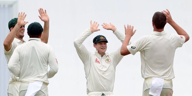 The Aussies players make the hand signal for the number of players they dismissed before tea.