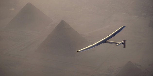 Solar Impulse 2, the solar powered plane, piloted by Swiss pioneer Andre Borschberg is seen during the flyover of the pyramids of Giza on July 13, 2016 prior to the landing in Cairo, Egypt in this photo released on July 13, 2016. Jean Revillard/SI2/Handout via Reuters/File Photo ATTENTION EDITORS - THIS IMAGE WAS PROVIDED BY A THIRD PARTY. FOR EDITORIAL USE ONLY.