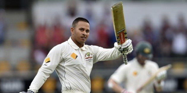 Australia's batsman Usman Khawaja celebrates his first Test century during day one of the first Test cricket match between Australia and New Zealand in Brisbane on November 5, 2015. AFP PHOTO / Saeed KHANIMAGE STRICTLY RESTRICTED TO EDITORIAL USE - STRICTLY NO COMMERCIAL USE (Photo credit should read SAEED KHAN/AFP/Getty Images)