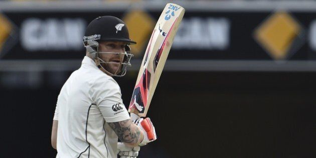 New Zealand captain Brendon McCullum looks back as Australia's fielder Adam Voges takes his successful catch off paceman Mitchell Johnson during day two of the first Test cricket match between Australia and New Zealand in Brisbane on November 6, 2015. AFP PHOTO / Saeed KHANIMAGE STRICTLY RESTRICTED TO EDITORIAL USE - STRICTLY NO COMMERCIAL USE (Photo credit should read SAEED KHAN/AFP/Getty Images)