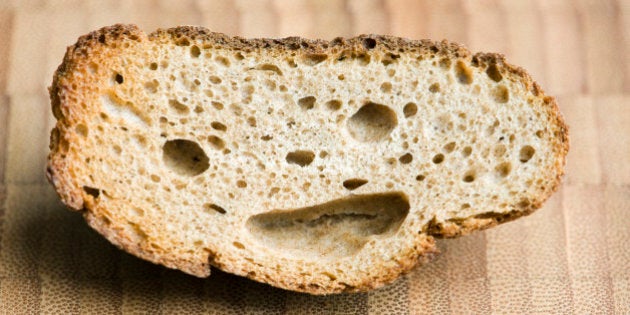 Piece of whole wheat bread with smiley face