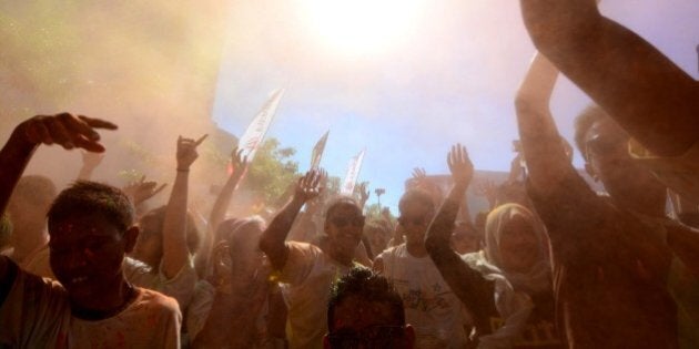 SUKOHARJO, INDONESIA - MARCH 15: Participants dance and celebrate during the Indo Color Run Party on March 15, 2015 in Sukoharjo, Indonesia. This event is aimed with the context of Indonesia's campaign against drugs.PHOTOGRAPH BY Sijori Images / Barcroft Media (Photo credit should read Sijori Images / Barcroft India via Getty Images)