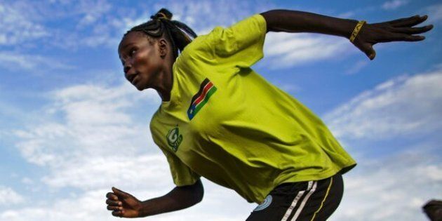 Margret Rumat Rumar Hassan, 19 years old, from Wau, South Sudan, trains at the open field of the Buluk Athletics Track in Juba, South Sudan, on March 18, 2016. Margret is currently training to be qualified for the Summer Olympic Games in Rio de Janeiro 2016 in the 200 metre and 400 metre events. Margret has already taken part in the Summer Youth Olympic Games in Nanjing, China, in 2014, as independent athlete. Since the South Sudan National Olympic Committee (NOC) was admitted by the International Olympic Committee (IOC) at the 128th IOC Session on 2 August 2015, this is the first time the country will be able to send its first athletes to the competition.Margret, who wants to become a teacher in the future, is still attending primary school because she missed more than 4 years education while she was displaced with her family during the war with Sudan. With five other brothers and sisters, Margret is struggling to convince her mother to go to the Olympics because she would like her to remain at home. AFP PHOTO / ALBERT GONZALEZ FARRAN / AFP / ALBERT GONZALEZ FARRAN (Photo credit should read ALBERT GONZALEZ FARRAN/AFP/Getty Images)