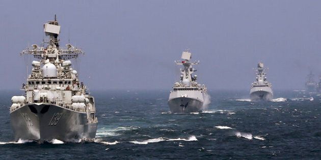 Chinese and Russian naval vessels participate in the Joint Sea-2014 naval drill outside Shanghai on the East China Sea, May 24, 2014. Chinese and Russian navies staged exercises on the East China Sea on Saturday to simulate anti-submarine and search-and-rescue operations. A total of 14 surface ships, two submarines, nine fixed-wing warplanes, six shipboard helicopters and two operational detachments are taking part in this year's week-long drill, state media reported. Picture taken May 24, 2014. REUTERS/China Daily (CHINA - Tags: POLITICS MILITARY) CHINA OUT. NO COMMERCIAL OR EDITORIAL SALES IN CHINA