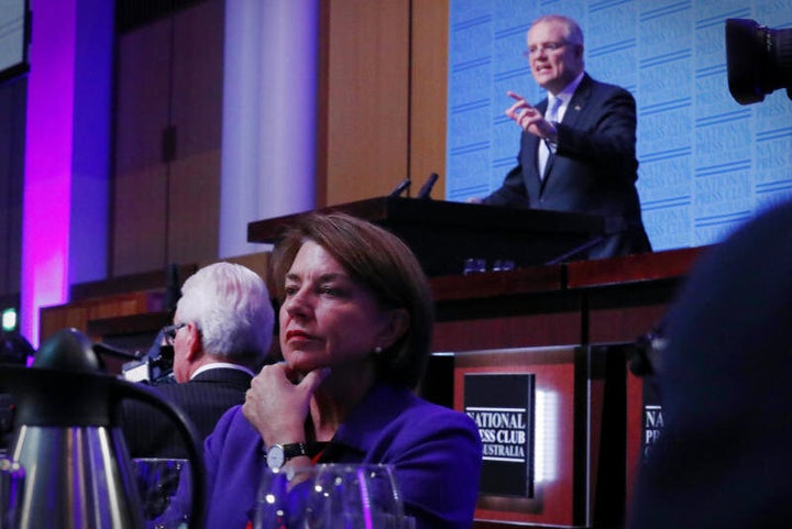 Anna Bligh listens as Treasurer Scott Morrison delivers his post-Budget address in the Great Hall at Parliament House