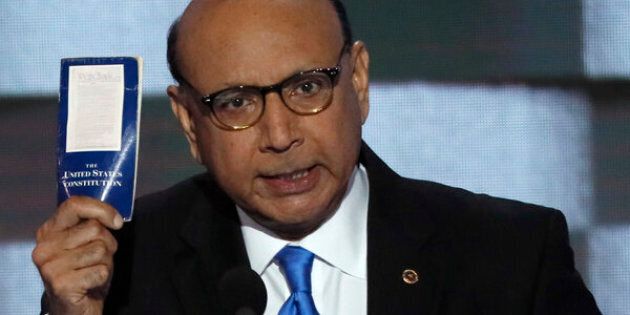 Khizr Khan, whose son, Humayun S. M. Khan was one of 14 American Muslims who died serving in the U.S. Army in the 10 years after the 9/11 attacks, offers to loan his copy of the Constitution to Republican U.S. presidential nominee Donald Trump, as he speaks during the last night of the Democratic National Convention in Philadelphia, Pennsylvania, U.S. July 28, 2016. REUTERS/Mike Segar