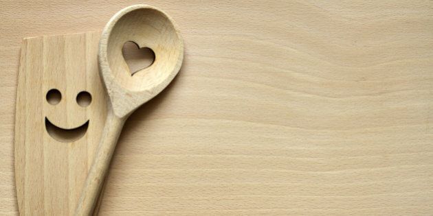 Wooden kitchenware on cutting board abstract food background