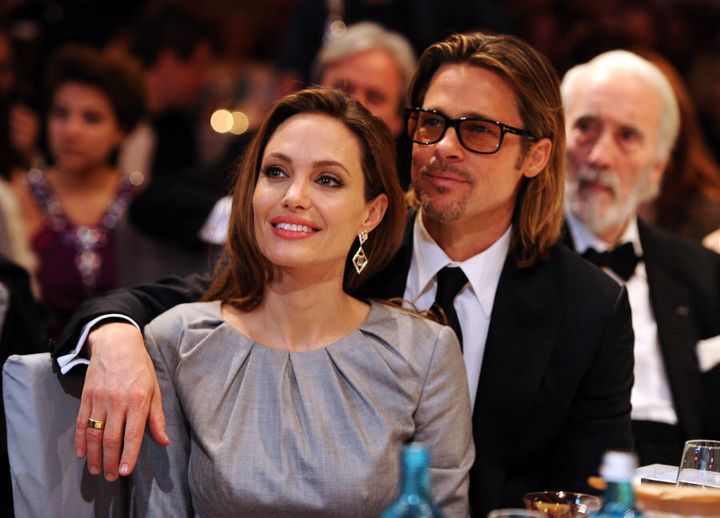 Angelina Jolie and Brad Pitt attend the "Cinema for Peace 2012" charity gala in 2012.