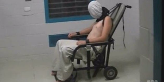 A teenage boy is strapped to a restraint chair at the Don Dale centre in the Northern Territory