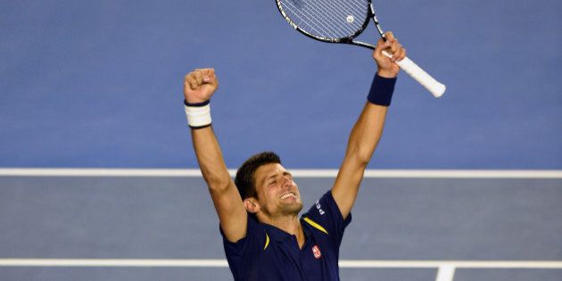 Novak Djokovic of Serbia celebrates his victory over Andy Murray of Britain in their men's singles final match on day 14 of the 2016 Australian Open tennis tournament in Melbourne on January 31, 2016. AFP PHOTO / GREG WOOD-- IMAGE RESTRICTED TO EDITORIAL USE - STRICTLY NO COMMERCIAL USE / AFP / GREG WOOD (Photo credit should read GREG WOOD/AFP/Getty Images)