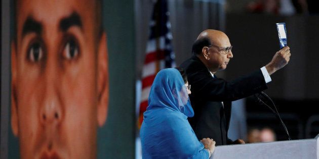 PHILADELPHIA, PA - JULY 28: Khizr Khan, father of deceased U.S. Army Capt. Humayun S. M. Khan, delivers remarks as he is joined by his wife Ghazala Khan on the fourth day of the Democratic National Convention at the Wells Fargo Center, July 28, 2016 in Philadelphia, Pennsylvania. Democratic presidential candidate Hillary Clinton received the number of votes needed to secure the party's nomination. An estimated 50,000 people are expected in Philadelphia, including hundreds of protesters and members of the media. The four-day Democratic National Convention kicked off July 25. (Photo by Joe Raedle/Getty Images)