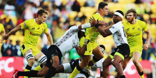 WELLINGTON, NEW ZEALAND - FEBRUARY 07: Greg Jeloudev of Australia charges forward during the Plate Final match between Australia and Fiji in the 2015 Wellington Sevens at Westpac Stadium on February 7, 2015 in Wellington, New Zealand. (Photo by Hannah Peters/Getty Images)