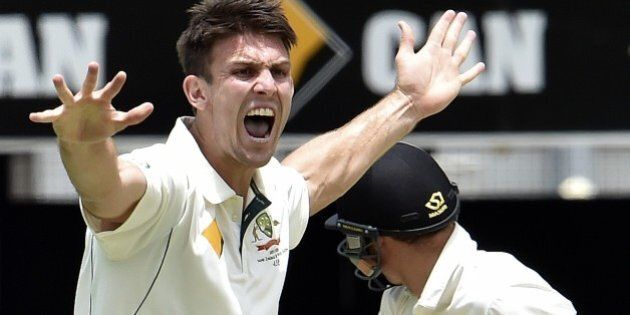 Australia's paceman Mitchell Marsh (L) shouts a successful leg-before-wicket appeal against New Zealand's Doug Bracewell (R) during the fifth and the final day of the first Test cricket match between Australia and New Zealand in Brisbane on November 9, 2015. AFP PHOTO / Saeed KHAN--IMAGE RESTRICTED TO EDITORIAL USE - NO COMMERCIAL USE-- (Photo credit should read SAEED KHAN/AFP/Getty Images)