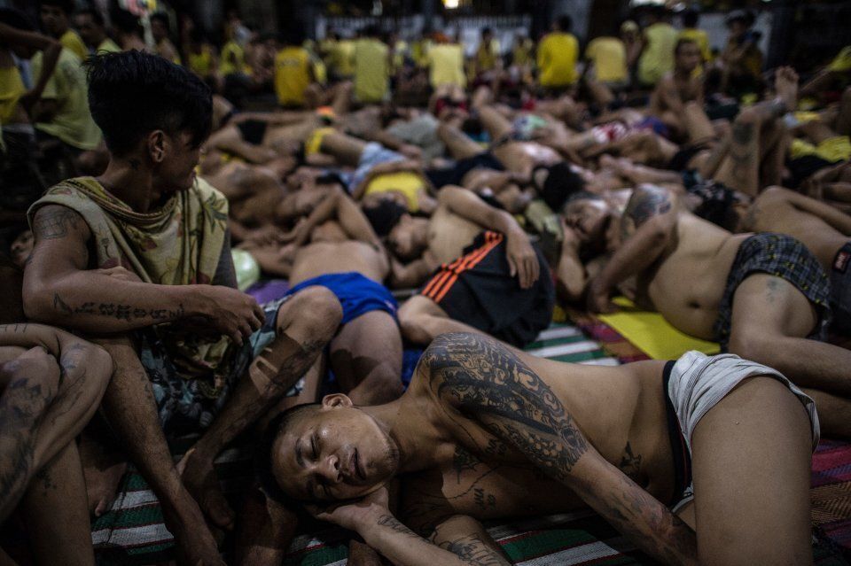 Inmates sleep on the ground at Quezon City jail because it was built to house 800, but there are currently 3,800 inmates.