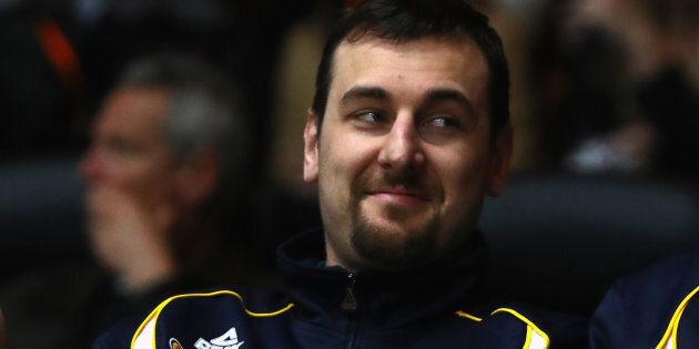 Andrew Bogut is having a cheeky spray at the Olympic Village.
