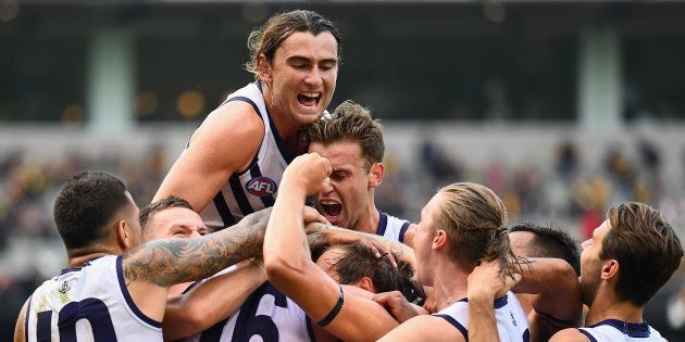 Somewhere in that ecstatic huddle is David Mundy, the veteran Freo Docker who kicked the winning goal against Richmond.