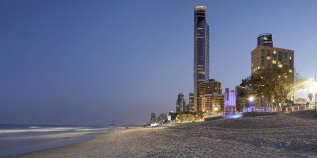 City apartments at night on ocean beach