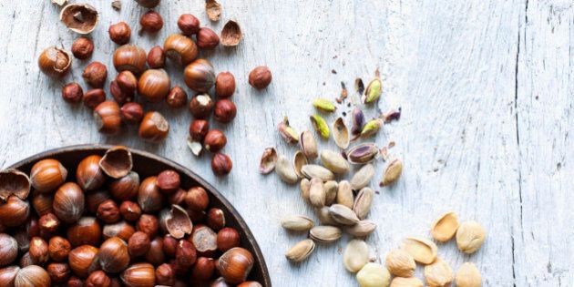 A selection of nuts on wood background