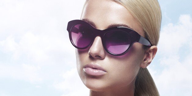 a pair of sunglasses that gets darker to sunlight and clear in the dark
