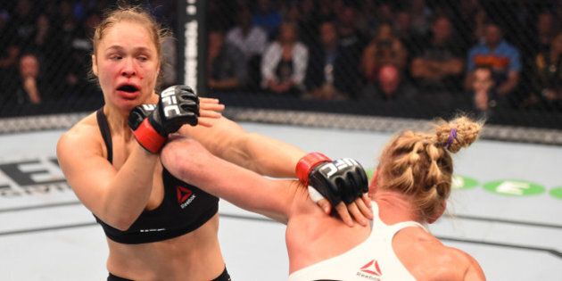 MELBOURNE, AUSTRALIA - NOVEMBER 15: (R-L) Holly Holm of the United States punches Ronda Rousey of the United States in their UFC women's bantamweight championship bout during the UFC 193 event at Etihad Stadium on November 15, 2015 in Melbourne, Australia. (Photo by Josh Hedges/Zuffa LLC/Zuffa LLC via Getty Images)