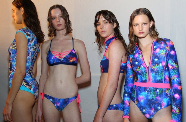 Models pose backstage ahead of the Swim show.