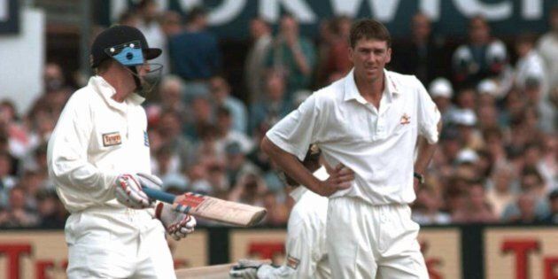 Australia's Glenn McGrath watches as England's Captain Michael Atherton, left, adds runs to England's score during morning play in the second day of the fourth test match at Headingley, Leeds Friday July 25 1997.(AP Photo/Rui Vieira)