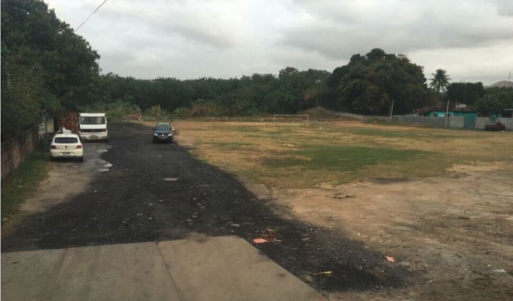 This soccer field in a slum area of Rio will be driven past every day by athletes going to shiny new venues.