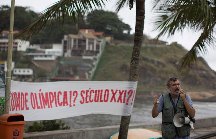 The Olympic city in the 21st century? Rio Biologist Mario Moscatelli protests against the pollution of Marapendi lagoon, along Barra da Tijuca beach. He has fought for the cleanup of polluted Rio waterways bordering Olympic Park for years, but no funds have been forthcoming from the government.