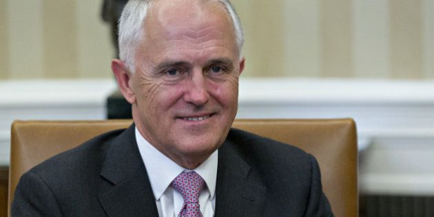 Malcolm Turnbull, Australia's prime minister, left, smiles as members of the media walk out as he meets U.S. President Barack Obama, not pictured, in the Oval Office of the White House in Washington, D.C., U.S., on Tuesday, Jan. 19, 2016. Turnbull says he plans to encourage U.S. lawmakers to support the pending Trans-Pacific Partnership free-trade agreement during his visit to Washington this week. Photographer: Andrew Harrer/Bloomberg via Getty Images