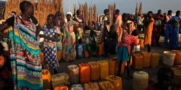 Women displaced by the fighting wait to get clean water at a water point in a camp for internally displaced persons (IDPs) at the United Nations (UN) base in Bentiu, Unity State.
