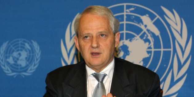 Australian Immigration Minister Philip Ruddock briefs the press at Geneva, Switzerland, on Wednesday, Dec.12,2001. He said that over the years