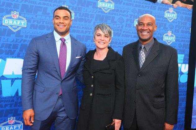 Proud parents with Solomon after the draft.