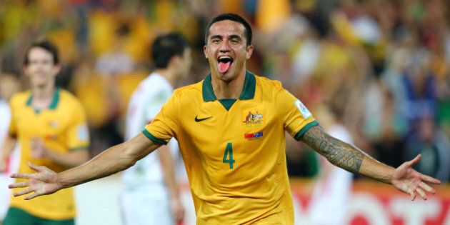 Australia's Tim Cahill celebrates after scoring his second goal during the AFC Asia Cup quarterfinal soccer match between China and Australia in Brisbane, Australia, Thursday, Jan. 22, 2015. (AP Photo/Tertius Pickard)
