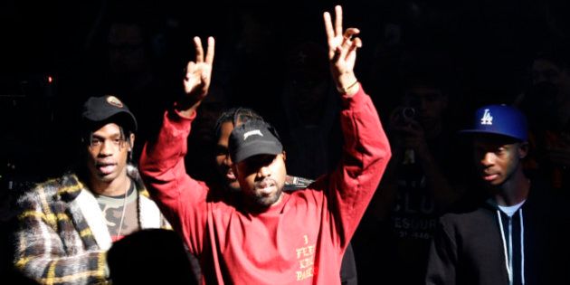 FILE - In this Feb. 11, 2016 file photo, Kanye West gestures to the audience at the unveiling of the Yeezy collection and album release for his latest album,