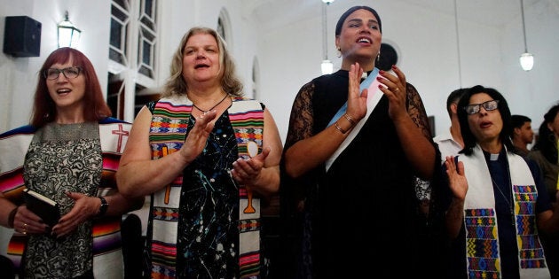 Trans Baptist reverend Allyson Robinson from the U.S. (L), trans pastors Cindy Bourgeois from Canada (2nd L) and Alexya Salvador from Brazil (2nd R) and lesbian pastor Elaine Saralegui sing during a mass in Matanzas, Cuba, May 5, 2017. Picture taken on May 5, 2017. REUTERS/Alexandre Meneghini