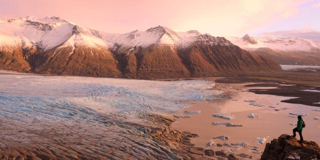 As this hiker demonstrates, standing at the edge of a cliff overlooking the Skaftafell Glacier in Skaftafell National Park, Iceland is an adventurer's dream.