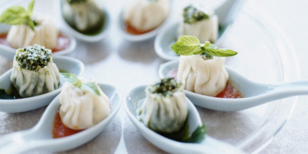 Dumplings on soup spoons