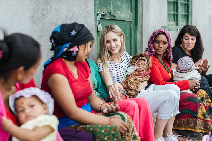 Justine Flynn chats to local mothers in Nepal.