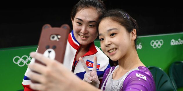 South Korea's Lee Eun Ju and North Korean gymnast Hong Un Jong take a selfie.