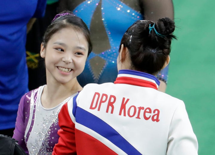 South Korea's Lee Eun-ju talks with North Korea's Hong Un Jong.